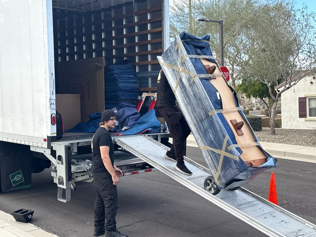 Second photo by Chris Naude of Muscular Moving Men - Large