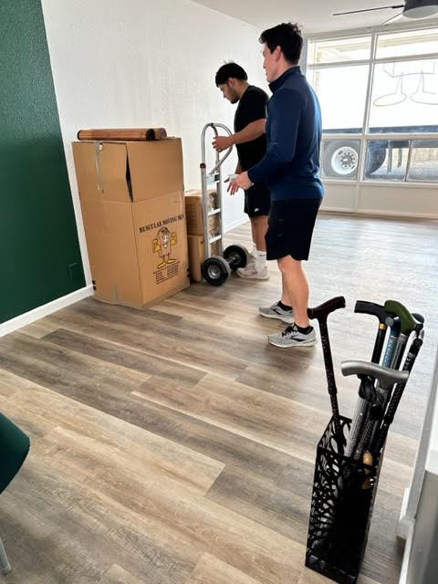 Second photo by Jan Morgan of Muscular Moving Men - Large