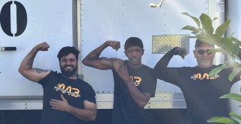 Thumbnail photo by Carol S Perry of Muscular Moving Men